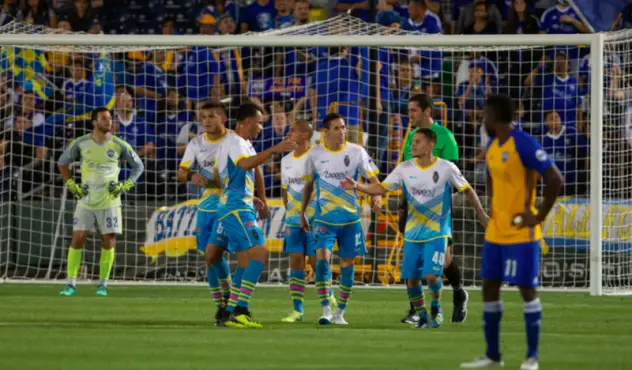 Las Vegas Lights FC' players celebrate a goal by Raul Mendiola (right)