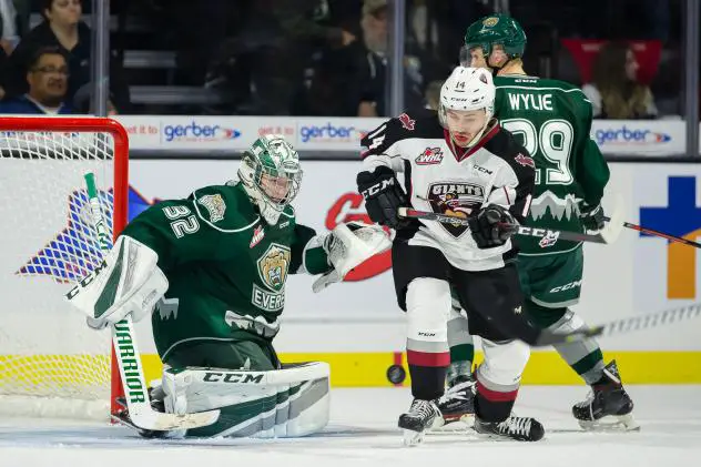 Vancouver Giants chase a loose puck against the Everett Silvertips