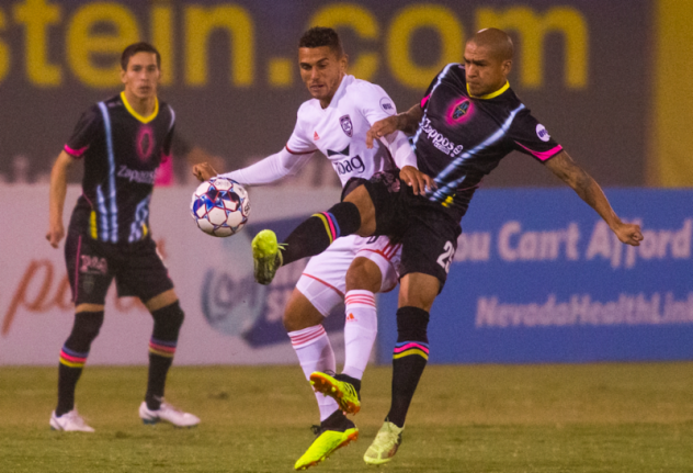 Las Vegas Lights FC's Rafael Garcia (right) fights for possession vs. Orange County SC