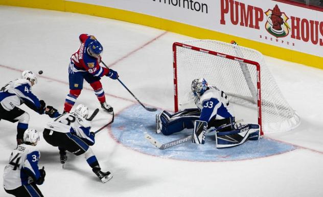 Saint John Sea Dogs goaltender Alex D'Orio tries to fend off the Moncton Wildcats