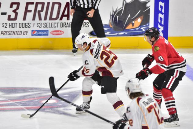 Alex Broadhurst of the Cleveland Monsters skates by the Rockford IceHogs