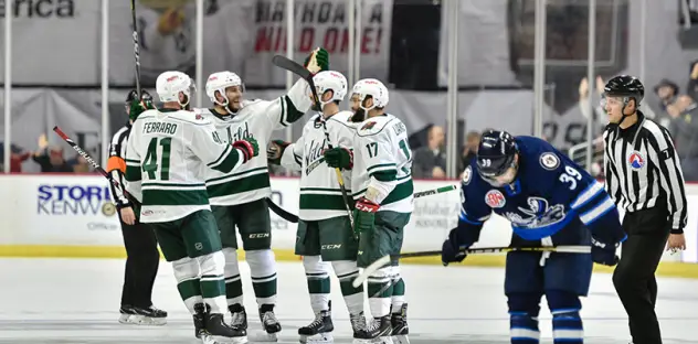 Iowa Wild celebrates a goal against the Manitoba Moose
