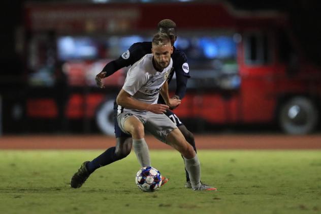 Sacramento Republic FC defender Elliot Hord screens off the opposition