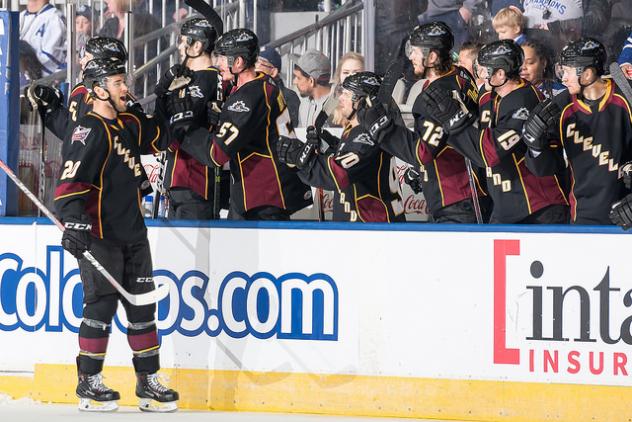 Cleveland Monsters C Justin Scott celebrates with the Cleveland bench