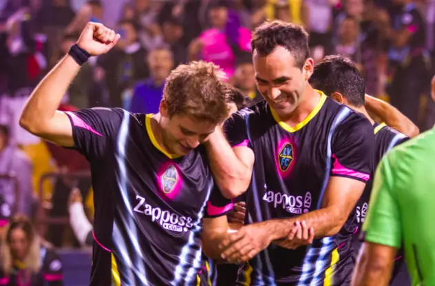 Las Vegas Lights FC's Alex Mendoza (left) and Juan Carlos Garcia celebrate a 5-2 victory over Phoenix Rising FC