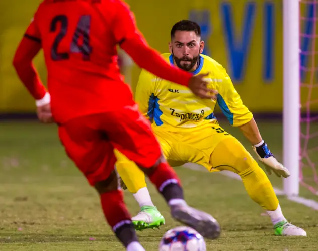 Las Vegas Lights FC goalkeeper Thomas Olsen prepares to make a save against Phoenix Rising