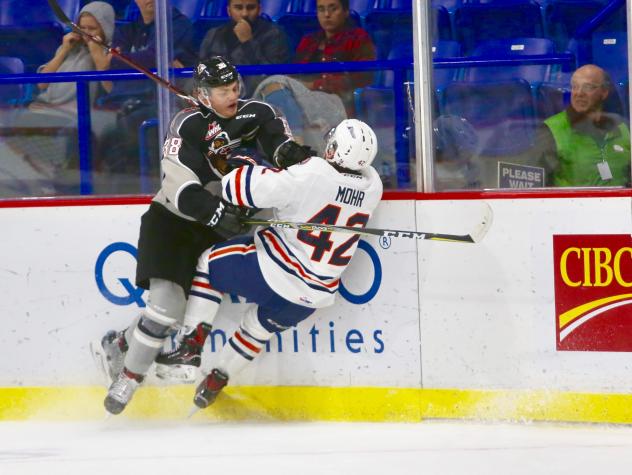 Vancouver Giants defenceman Ty Ettinger delivers a hit on the Kamloops Blazers