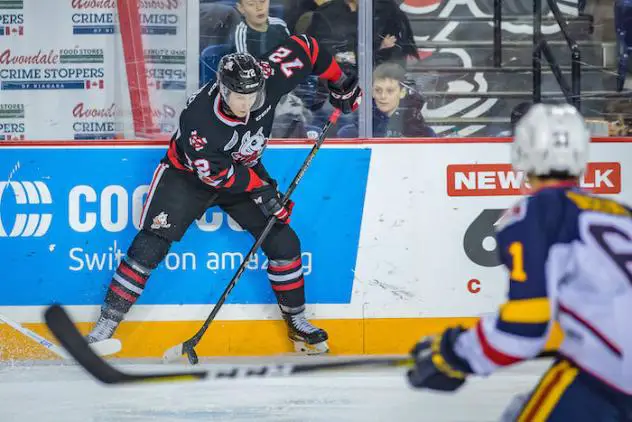 Niagara IceDogs handle the puck vs. the Barrie Colts
