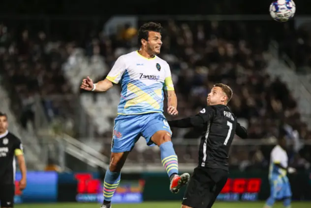 Las Vegas Lights FC's Sammy Ochoa goes high for possession vs. Sacramento Republic FC