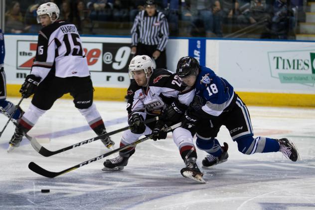 Vancouver Giants RW Jared Dmytriw holds off the Victoria Royals