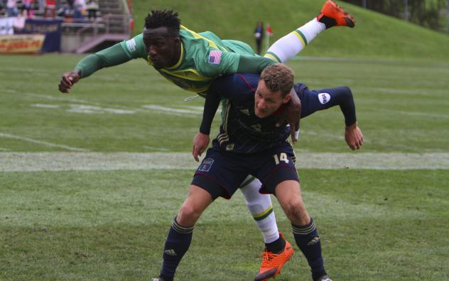 Fabian Herbers of Bethlehem Steel FC sends a member of the Tampa Bay Rowdies airborne