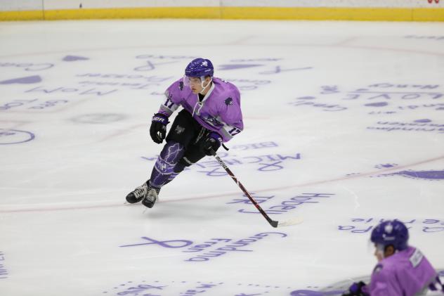 Tri-City Storm skate on Color Out Cancer ice