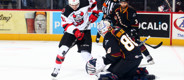 Binghamton Devils C Brett Seney vs. Cleveland Monsters goaltender Matiss Kivlenieks