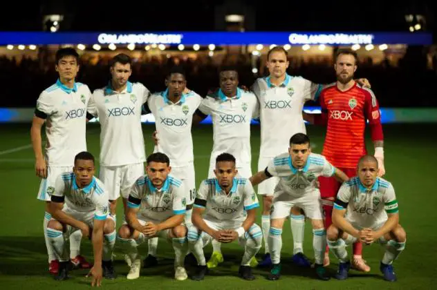 Seattle Sounders FC players wear black armbands honoring Paul Allen