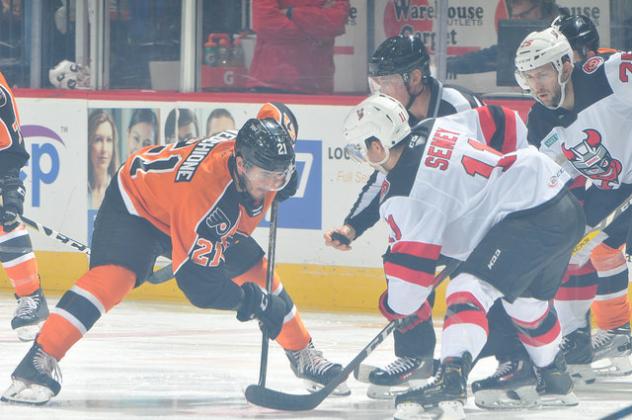 Lehigh Valley Phantoms C Mike Vecchione faces off with the Binghamton Devils
