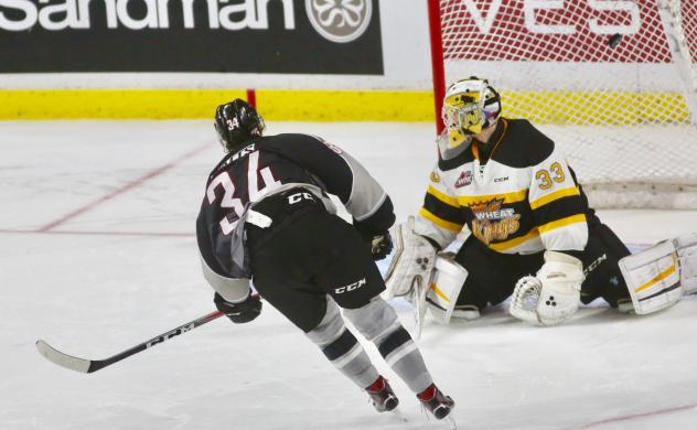 Brayden Watts of the Vancouver Giants eyes the Brandon Wheat Kings goal
