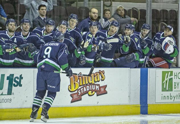 Maine Mariners forward Drew Melanson receives congratulations from his bench