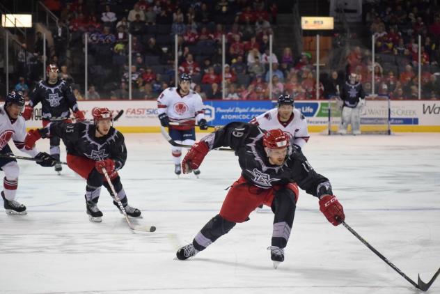The Allen Americans race for a puck against the South Carolina Stingrays