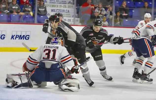 Vancouver Giants C Dawson Holt scrambles in front of the Kamloops Blazers' net