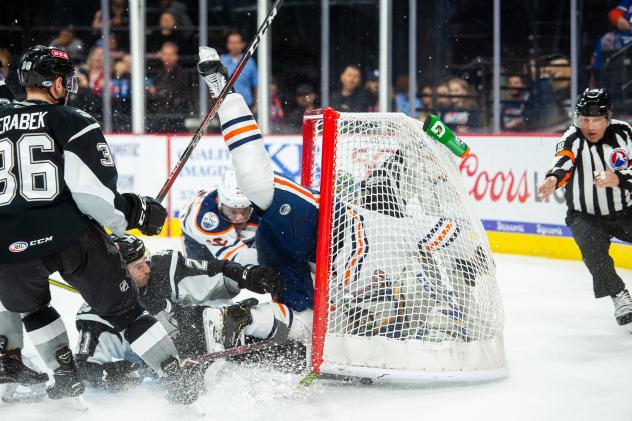 Brad Malone of the Bakersfield Condors collides with San Antonio Rampage goaltender Jordan Binnington as the Condors tie the game