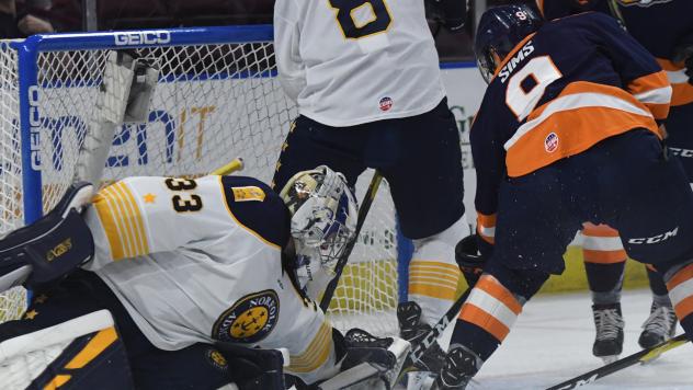 Greenville Swamp Rabbits forward Jordan Sims tries to get past the Norfolk Admirals goaltender