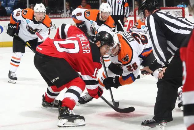 Phil Varone of the Lehigh Valley Phantoms (26) faces off with the Binghamton Devils
