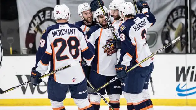 The Greenville Swamp Rabbits congratulate forward Austen Brassard on his game-winning goal