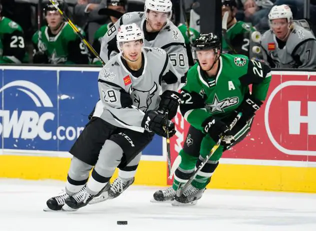 Jordan Kyrou of the San Antonio Rampage races for a puck against Texas Stars forward Erik Condra