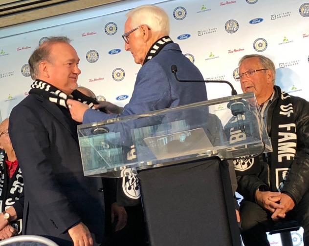 Ron Toigo, Majority Owner, Governor and President of the Vancouver Giants, receives a Hall of Fame scarf
