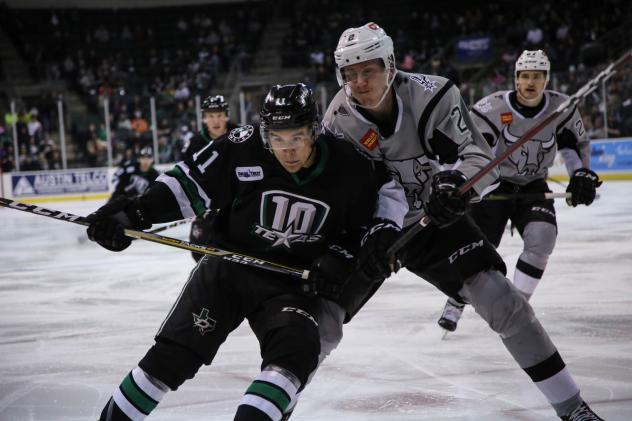 Niko Mikkola of the San Antonio Rampage battles Joel L'Esperance of the Texas Stars for a loose puck