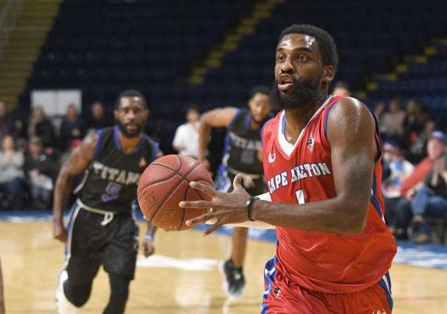 Bruce Massey of the Cape Breton Highlanders heads to the hoop against the KW Titans