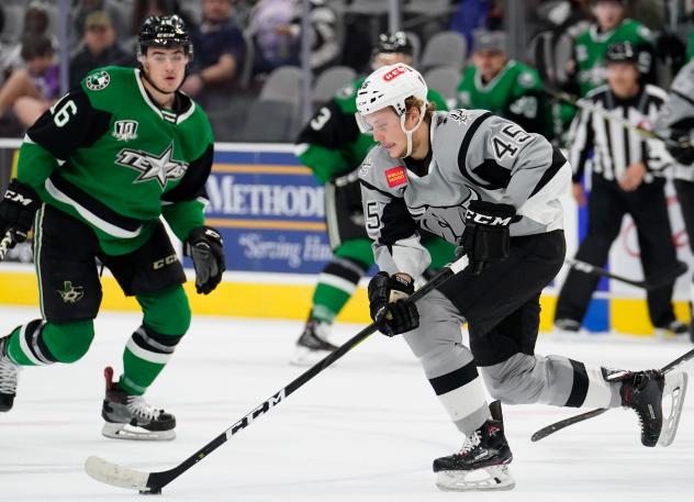 Ryan Olsen of the San Antonio Rampage controls the puck against the Texas Stars' Nicholas Caamano