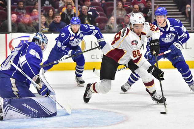 Cleveland Monsters RW Kole Sherwood skates against the Syracuse Crunch defense