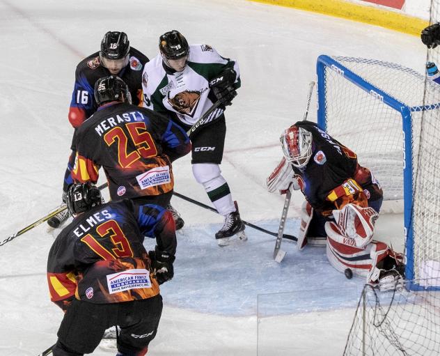 Rapid City Rush goaltender Adam Carlson stops a Utah Grizzlies shot