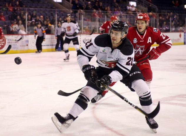 Allen Americans defenseman David Makowski (back) tries to get past the Rapid City Rush