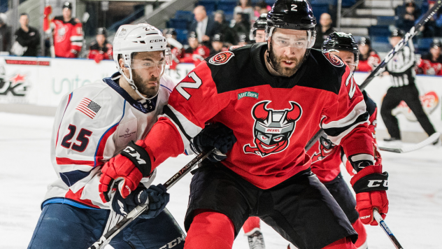 Binghamton Devils center Egor Sharangovich holds off the Springfield Thunderbirds