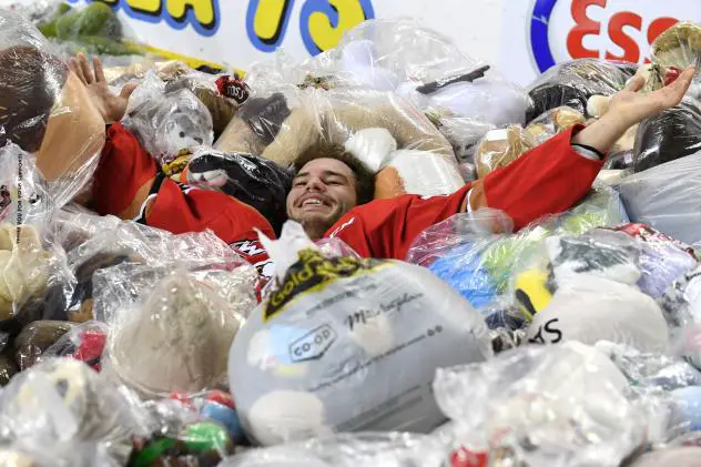 Calgary Hitmen forward Kaden Elder in a pile of bears