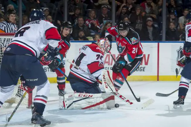 Kelowna Rockets C Kyle Topping presses the Lethbridge Hurricanes