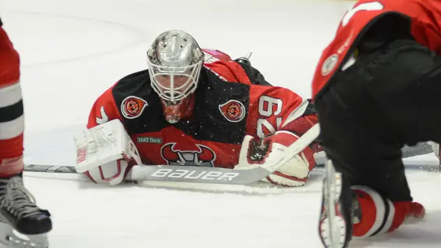 Binghamton Devils goaltender Mackenzie Blackwood sprawls on the ice