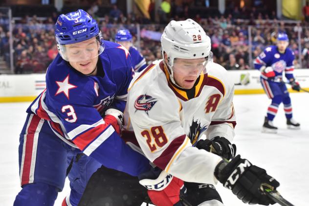 Cleveland Monsters center Zac Dalpe (right) and the Rochester Americans battle