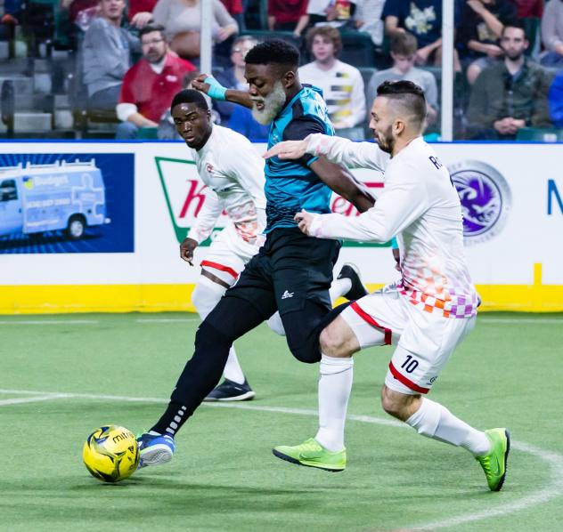 St. Louis Ambush forward Jerjer Gibson splits the Kansas City Comets defense