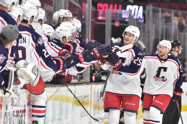 Cleveland Monsters center Alex Broadhurst (25) high fives the bench