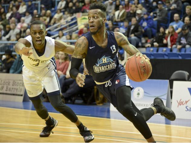 Halifax Hurricanes guard Joel Kindred drives around a Saint John Riptide defender