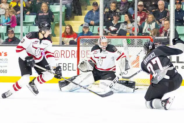 Jared Legien of the Vancouver Giants fires at the Red Deer Rebels goal
