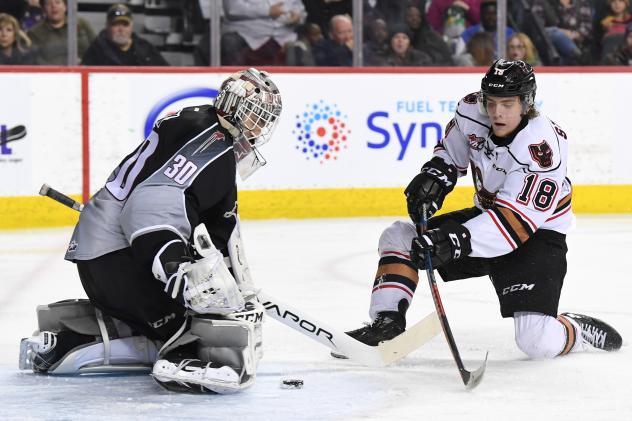 Vancouver Giants goaltender David Tendeck stops the Calgary Hitmen