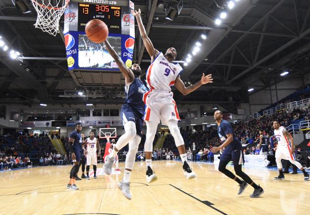 Halifax Hurricanes and Cape Breton Highlanders vie for a loose ball