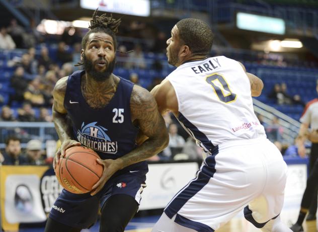 Halifax Hurricanes forward Gabe Freeman (left) eyes the hoop vs. the Saint John Riptide