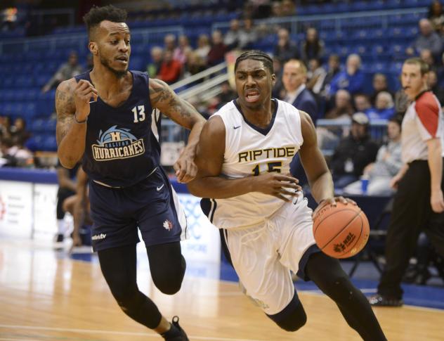 Halifax Hurricanes guard Joel Kindred (left) defends against the Saint John Riptide