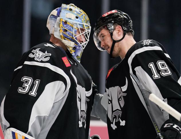 Mackenzie MacEachern and Jordan Binnington celebrate the San Antonio Rampage's seventh straight win at home