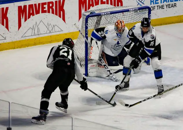 Austin Carroll of the Utah Grizzlies (21) eyes the goal vs. the Wichita Thunder